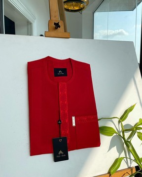 A tomato red, slanted vertical front flap &amp; pocket embroidery detailing kaftan