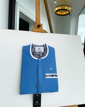 A cerulean blue, vertical Flap with horizontal paisley patch pocket