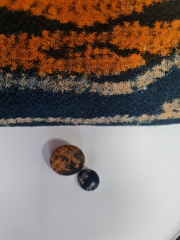 Button covered in loincloth fabric