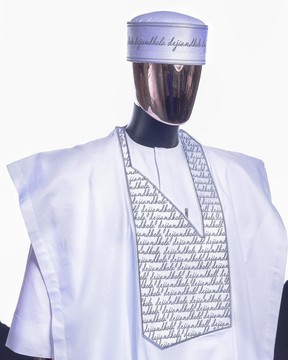 A white, grey scritto pattered (dejiandkola) embroidery detailing Agbada
