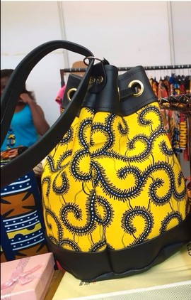Bucket bag in wax and imitation leather