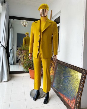 The reloaded monochrome “ Festac 77” mustard yellow 3 button safari suit