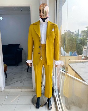 The reloaded “ Festac 77” mustard yellow 3 horn button safari suit