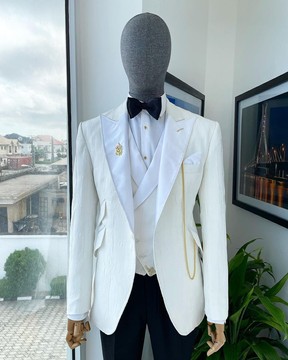 An ivory white tear drop pattern jacquard hand picked peak lapel Suit