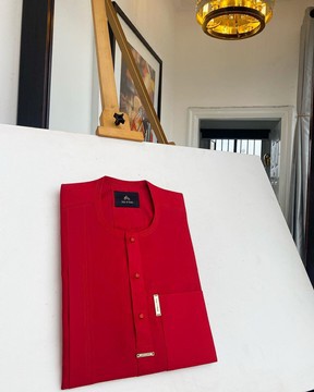 A lipstick red,  traditional senator kaftan native.