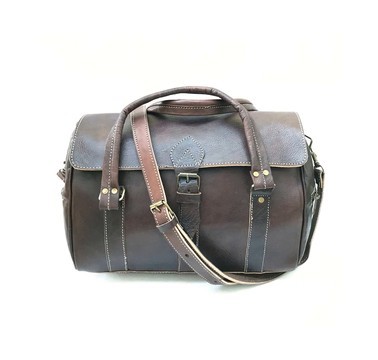real travel bag in genuine brown leather