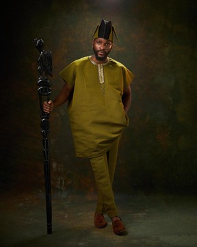 An olive green, champagne gold hand-beaded dashiki