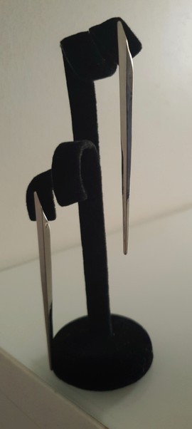A pair of simple and elegant earrings in light silver color