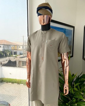 A Sand dollar beige, clear view Swarovski button with orange embroidery flap &amp; pocket kaftan