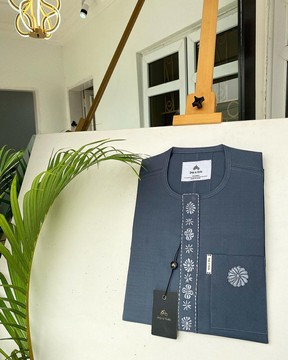 A shade of Grey senator kaftan with a dispersly connected embroidery design.