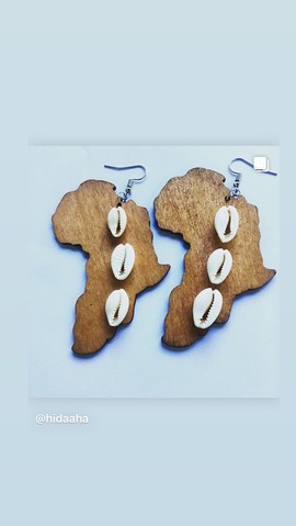 Beautiful pair of metal and cowrie earrings
