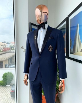 A classic Navy blue, peak lapel tuxedo suit