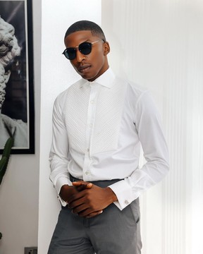A white, cut-away, pleated evening tuxedo shirt.