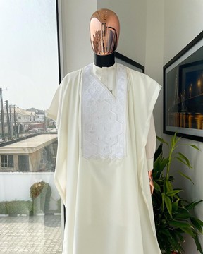 An ivory white precision 3D imagery embroidery agbada, buba &amp; sokoto