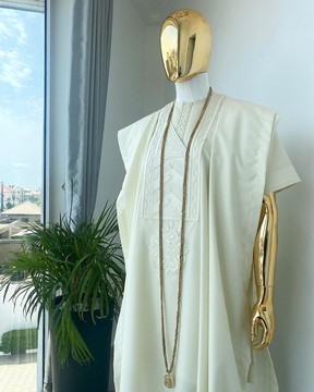 A cream Agbada with interwoven embroidery design