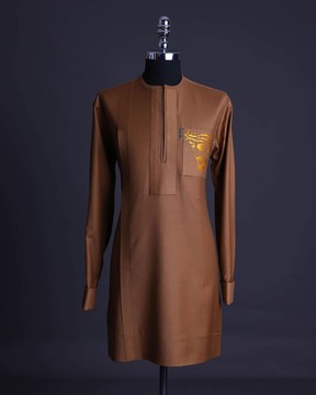 A Gingerbread brown, wide double lane flap, patch pocket with “Golgotha” embroidery kaftan