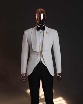 An ivory white, elastic, basket weave layered floral jacquard shawl lapel tuxedo suit.