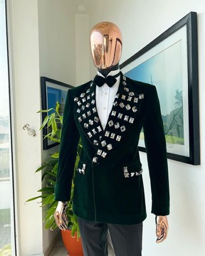 A Sacramento green soaked velvet peak lapel double breasted suit