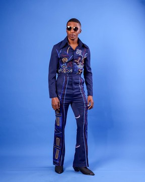 A Navy Blue, “Anikulapo” Arewa Embroidery Top And Pant.