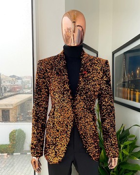 The “Young &amp; Restless” fire orange peak lapel suit, matching turtle neck &amp; black pant trousers.