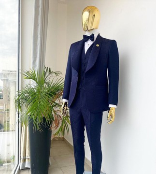 A shawl lapel midnight blue tuxedo suit
