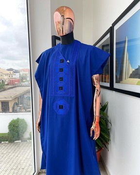A cobalt blue, interwoven octagon embroidery design agbada