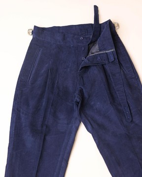 A “Gurkha”pant Trouser with pleats, double side strap buckle.