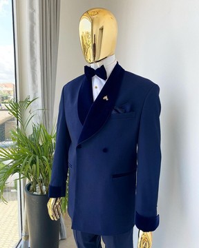An midnight blue soft merino wool shawl lapel tuxedo suit.