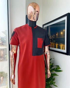 A rosso corsa red, half cut black paisley detailing with mandarin knot button kaftan native.