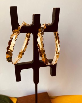 Magnificent pair of gold-colored hoop earrings with
