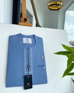 A maya blue, rail line flap with a combat pocket Swarovski button details kaftan