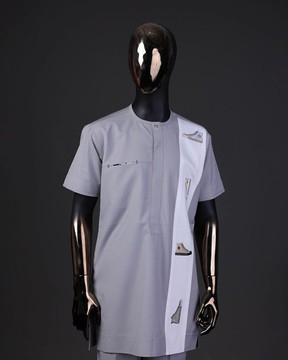 A pewter grey, front flap with gold Swarovski button, embroidery detailing on white kaftan