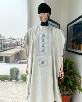 An pearl ivory, interwoven octagon embroidery design agbada, short sleeve buba &amp; sokoto.