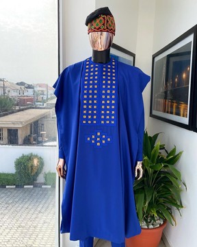 An azure blue, connected square embroidery design with gold threading agbada, buba &amp; sokoto