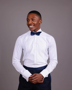 A white, tuxedo shirt with dotted front details.