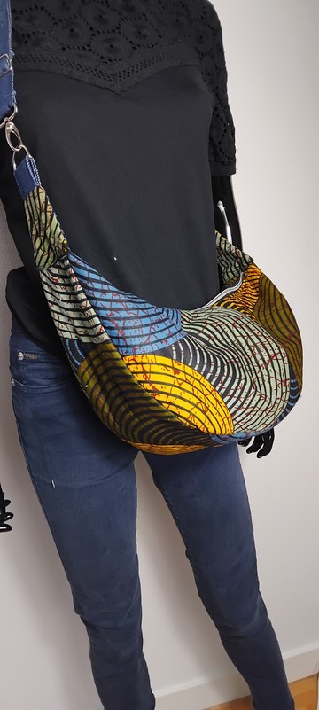 Half-moon wax print handbag