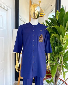 A navy blue “shirtan” traditional senator kaftan native.