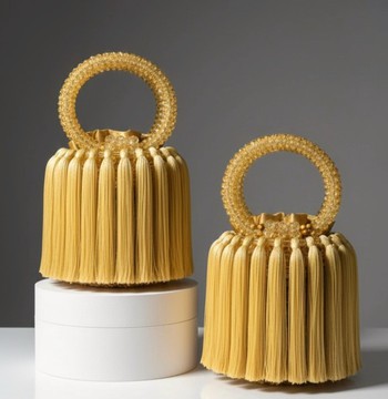 Sac rond africain à perles et pompon doré
