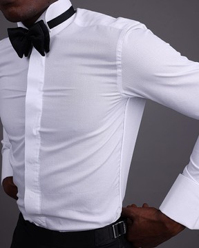 A white, covered button, connected paisley print wing collar tuxedo shirt.
