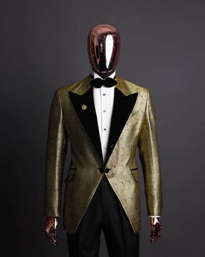 A gold metallic jacquard peak lapel suit