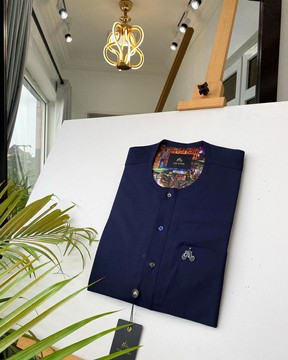 A Navy Blue Kaftan, With mixed Swarovski buttons detailing.