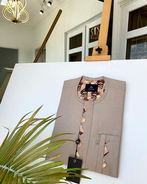 A dark cream tailored kaftan.
