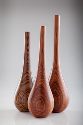 A set of 3 Wooden candlestick holders
