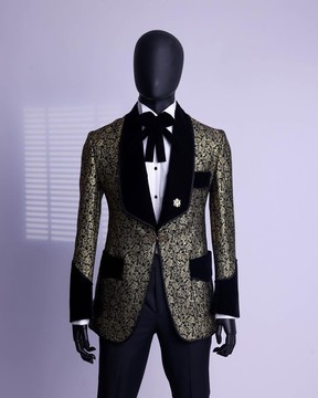 A gold and black patterned metallic Jacquard tuxedo suit