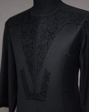 A charcoal black, zip line with ocean element jacquard kaftan native.
