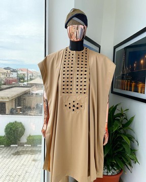 A tan brown, connected square embroidery design with black detailing agbada, buba &amp; sokoto