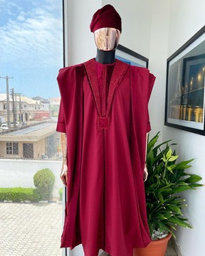 A Maroon red, vehicular lapelled with closed line flap &amp; marching velvet mix embroidery Agbada