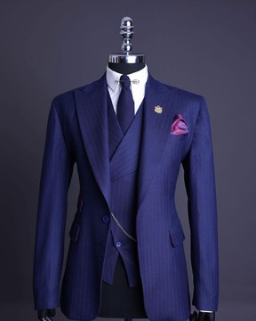 A Navy blue, herringbone nobility super “140s” “Board Room” Peak lapel suit