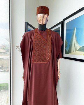 A cinnamon brown agbada, spiral bonding embroidery detailing with black and gold Swarovski Agbada