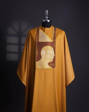 A tawny brown, “Head Algorithm Mapping ” embroidery details agbada.